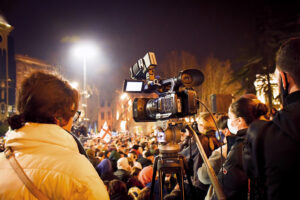 Tbilisi, Georgia 1st march, 2022: news media journalist film protest event with crowd in Georgia capital Tbilisi streets