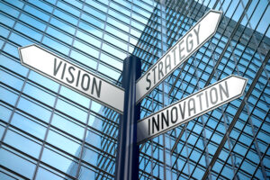 Vision, strategy, innovation crossroads sign, office building