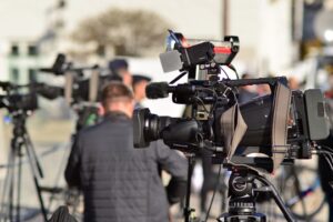 small warsaw poland 24 october 2023 group of professional journalists and reporters with video and photo camera do reportage and live stream the presidential palace